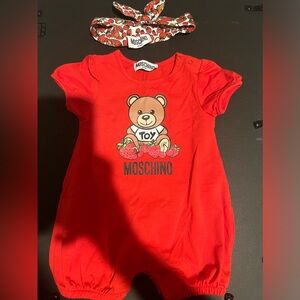 Moschino romper with bow worn only once in great condition . 1-3 months .
